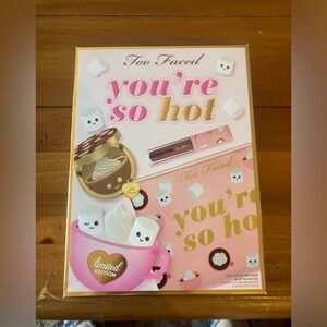 Too Faced “You’re so hot” limited edition makeup bag with makeup.